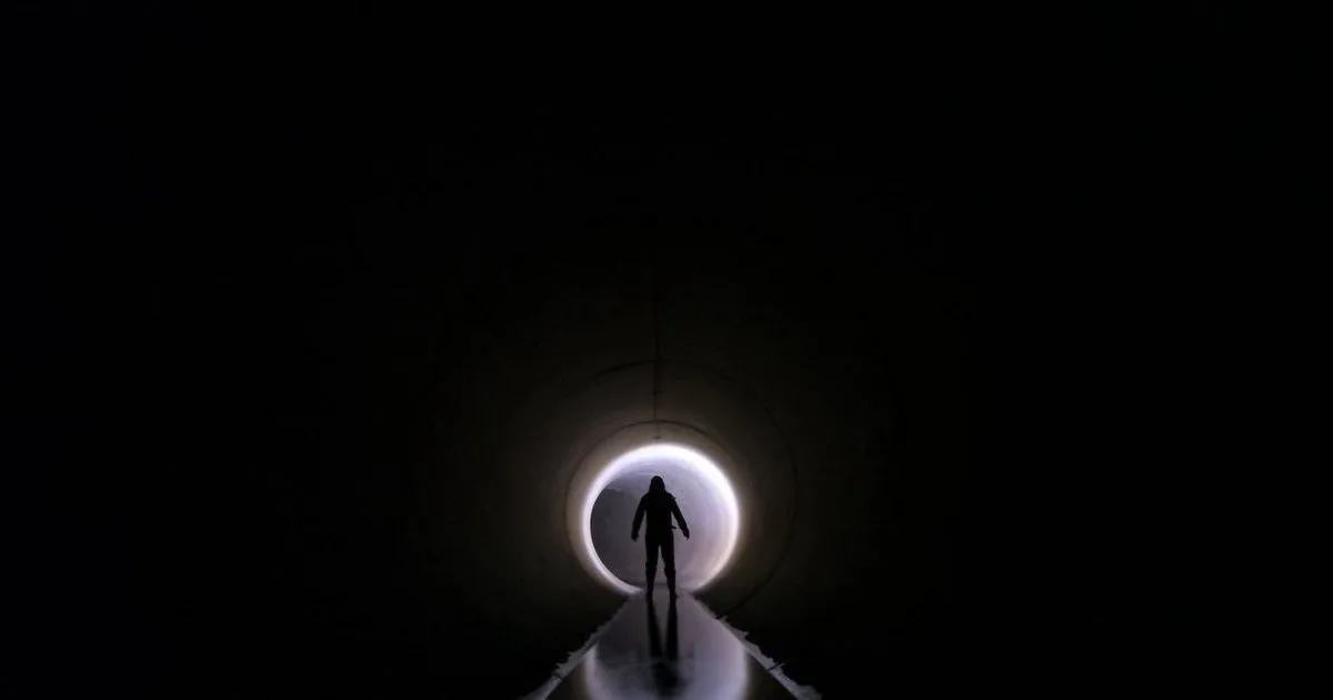 Silhouette in a dark tunnel — the dark web's migration from Bitcoin to Monero